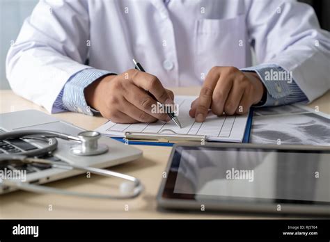 Health care writing prescription Doctor working with laptop computer ...