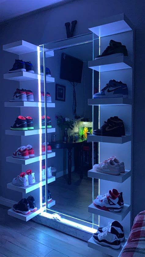 an illuminated shoe rack in the corner of a room