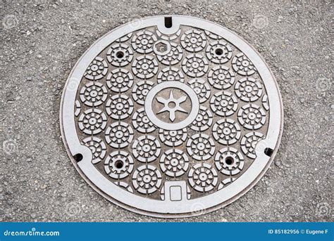 Round design Manhole Cover stock photo. Image of background - 85182956