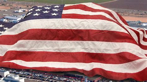 Giant American Flag Draped Over Entire Stadium During National Anthem