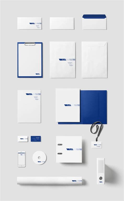 various stationery items are displayed on a white surface with blue accents, including envelopes ...