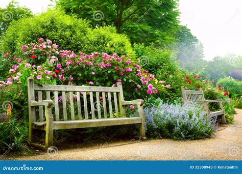 Art Bench And Flowers In The Morning In An English Park Stock Photos ...