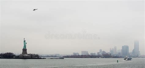 Statue of Liberty with Manhattan Skyline and Helicopter Stock Image ...