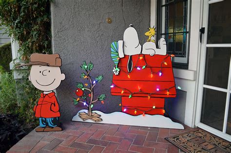 Made some Peanuts themed yard art for my wife, will add pieces to it over the years… | Christmas ...