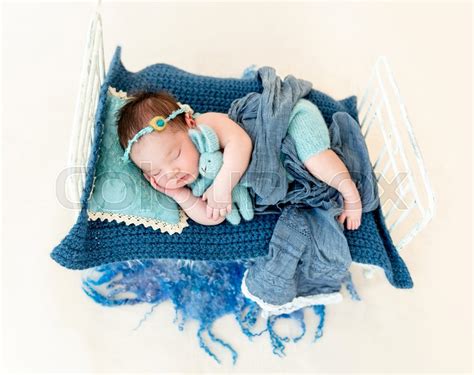 Newborn Baby Girl Sleeping In A Little Bed Stock Image Colourbox | ubicaciondepersonas.cdmx.gob.mx