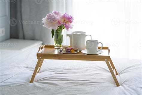 Tray with breakfast on bed. 16070885 Stock Photo at Vecteezy