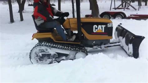 Mini Cat Challenger Tractor snow plowing - YouTube