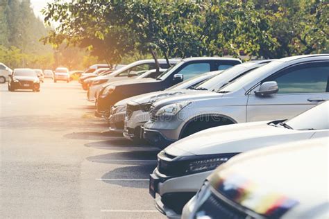 The Cars In The Parking Lot On Sunset Background Stock Photo - Image of parking, garage: 165511398