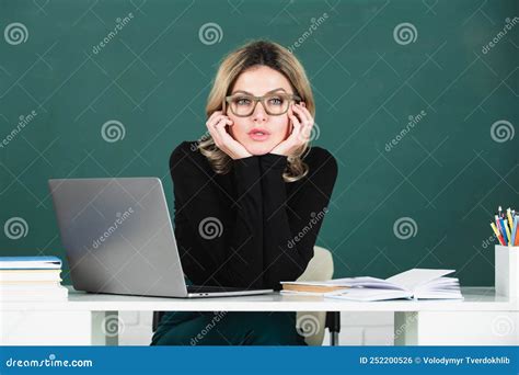 Portrait of Teacher at School with Computer Laptop in Classroom on ...