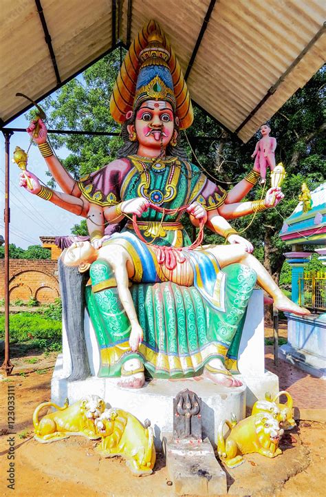 Statue of the deity Parameshvara at the entrance to ancient temple Parameswara the XVI century ...