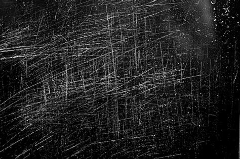 Premium Photo | White scratches on a black background. chaotic ...