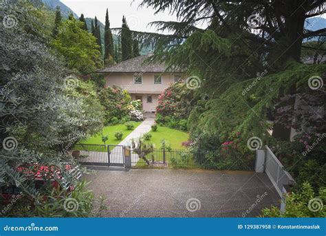 Luxury Blue House with Beautiful Landscaping on a Sunny Day Stock Photo - Image of expensive ...