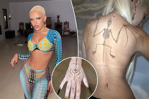 Doja Cat reveals controversial new tattoos in topless snap