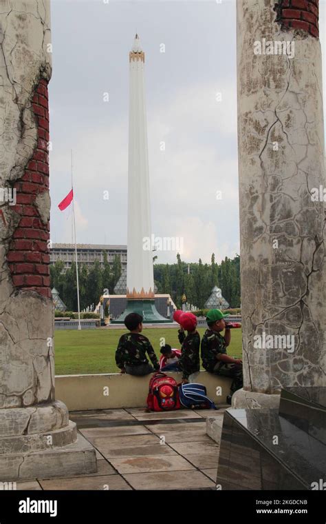 SURABAYA, INDONESIA - April 20, 2018 : People relax on location Tugu Pahlawan - National ...