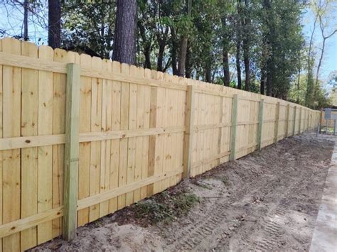 How Long to Wait Before Staining a Pressure Treated Wood Fence