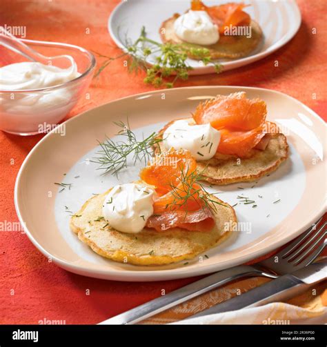 Blinis with smoked salmon, crėme fraîche and dill Stock Photo - Alamy