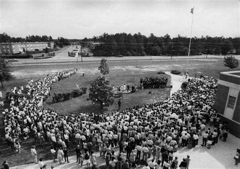 May 29, 1970 — Douglas S. Freeman High School students gathered around flag pole. Flag being ...