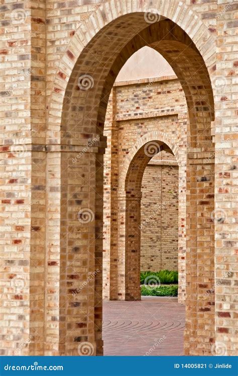 Brick building arches stock image. Image of yellow, pavement - 14005821