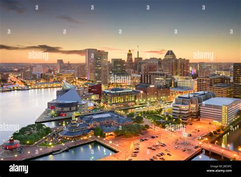 Baltimore, Maryland, USA inner harbor and downtown skyline at dusk ...