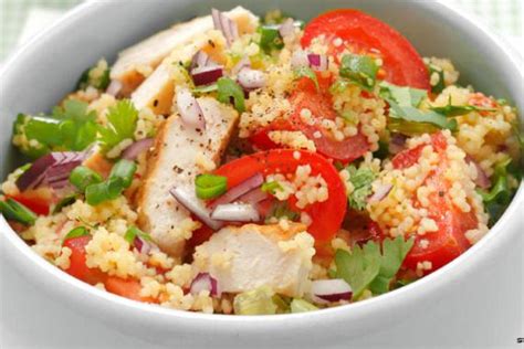 Couscous salad with grilled chicken breast, tomatoes and herbs