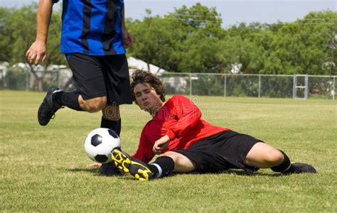 Football - Soccer - Tackle! Stock Photo - Image of leisure, cleats: 1136834