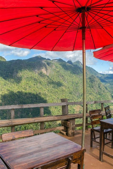 Beautiful Outdoor Cafe with Traditional Red Thai Umbrellas in No Stock Image - Image of tables ...