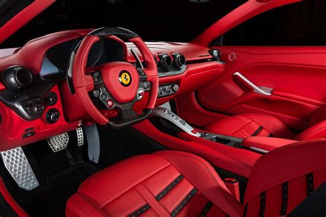 the interior of a red sports car