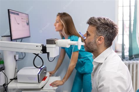 Premium Photo | Man performing pulmonary function test and spirometry ...