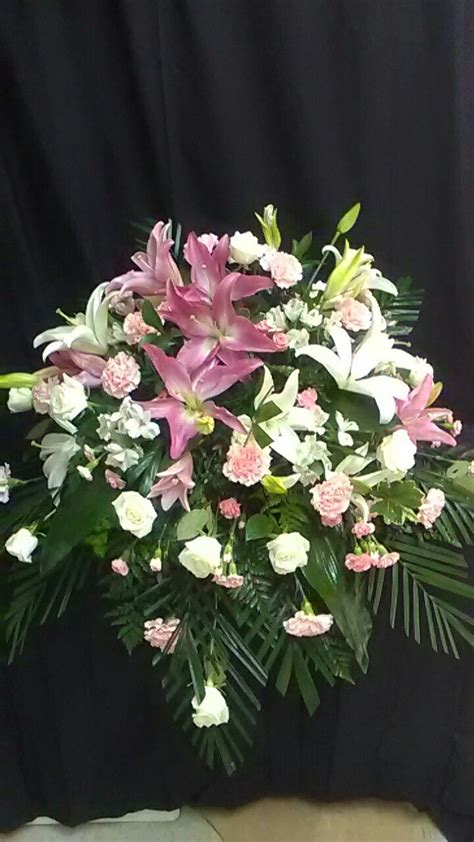 casket spray... lilies, carnations, alstroemeria, and roses