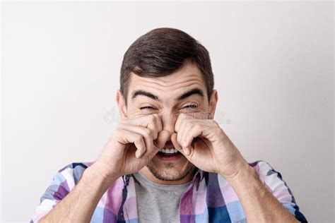 Close-up Portrait of a Young Caucasian Man, Rubs His Eyes with His ...