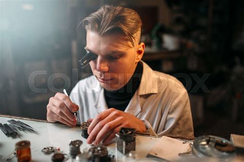 Clock maker repair old clockwork gear | Stock image | Colourbox