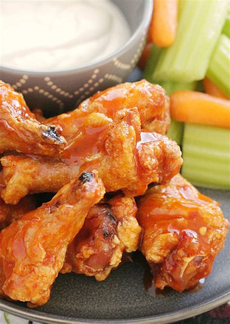 Crispy Baked Chicken Wings - with the best buffalo sauce - Foodtastic Mom