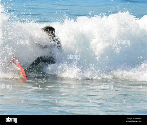 Surfing at Zuma beach California Stock Photo - Alamy