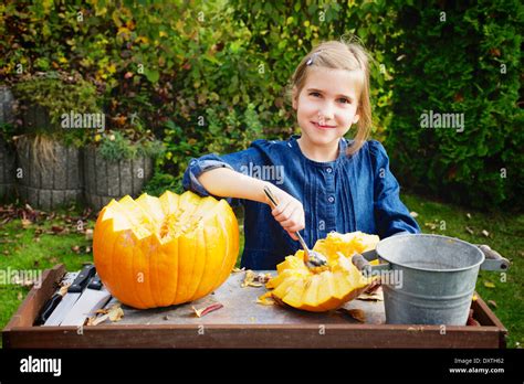 Girl carving Jack O'Lantern Stock Photo - Alamy