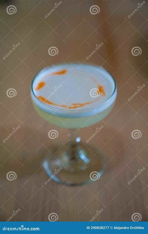 Delicious Pisco Sour Cocktail with Egg White Pisco and Lime Juice at Peruvian Restaurant Stock ...