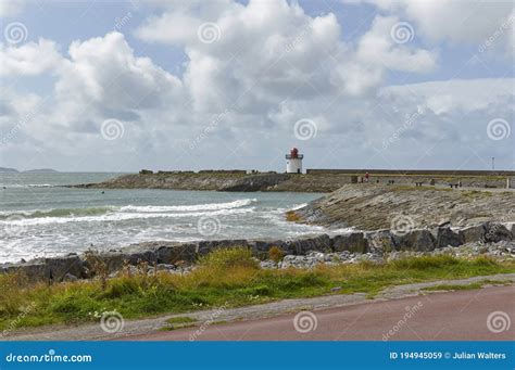 Burry Port Harbour Entrance and Breakwater with Small Old Stone Lighthouse. Stock Image - Image ...