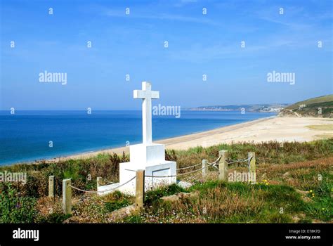 The memorial cross for the lost crew of the shipwrecked HMS Anson in 1807 off Loe Bar near ...