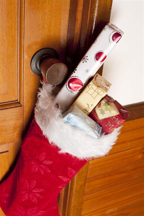 Photo of Colorful Christmas gifts filling a red stocking | Free christmas images