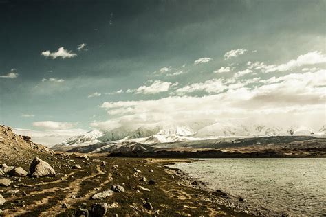 Distant 7000m Tall Mountains And An Photograph by Tim Martin - Pixels