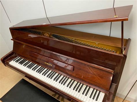 Lot 745 - Yamaha upright grand piano.