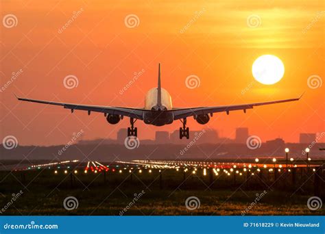 Plane is Landing during Sunrise. Stock Image - Image of dusk, clouds: 71618229