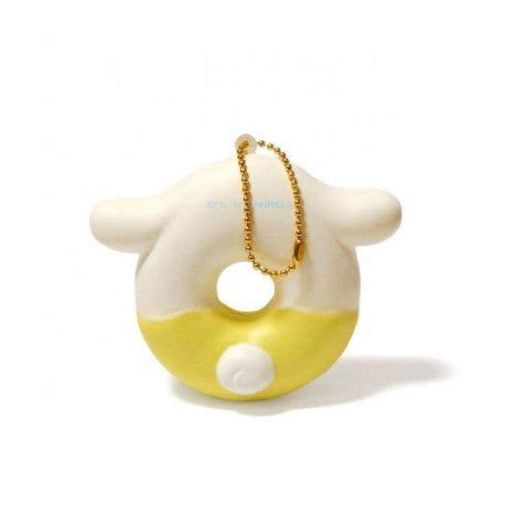 a yellow and white toy with a chain around it's neck on a white background