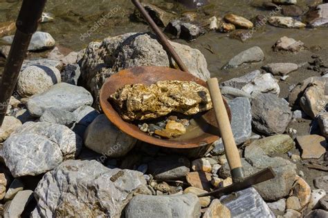 Gold Nugget mining from the River — Stock Photo © Luftklick #113218026