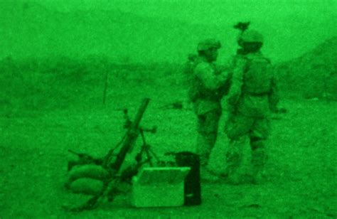 A night vision view of US Army (USA) members of the 82nd Airborne Division, Alpha Company, from ...