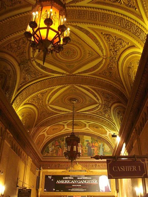 an ornate ceiling and chandelier in a building