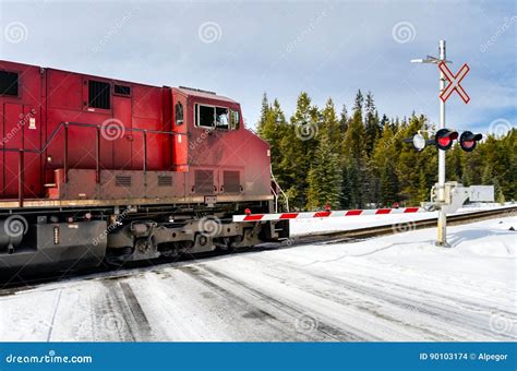 Cargo Train at a Snow Covered Railroad Crossing Stock Photo - Image of ...