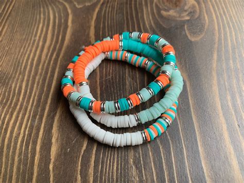 Teal Mix Clay Bracelets - Etsy | Clay bead necklace, Beads bracelet ...