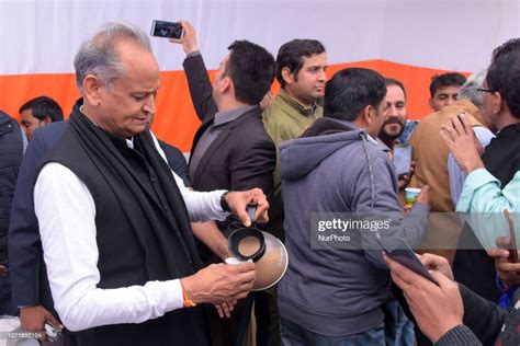 Former Rajasthan chief minister Ashok Gehlot serves tea to the... News Photo - Getty Images