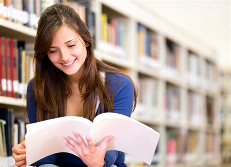 Woman reading at the library - Wayland Free Public Library