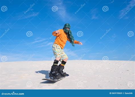 Man Snowboarding Amongst the Sand Dunes - Unusual Use Stock Image ...